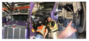 A purple semi-truck in a garage, two workers inspecting the engine, and a hand pointing at a worn part on the truck’s wheel assembly.