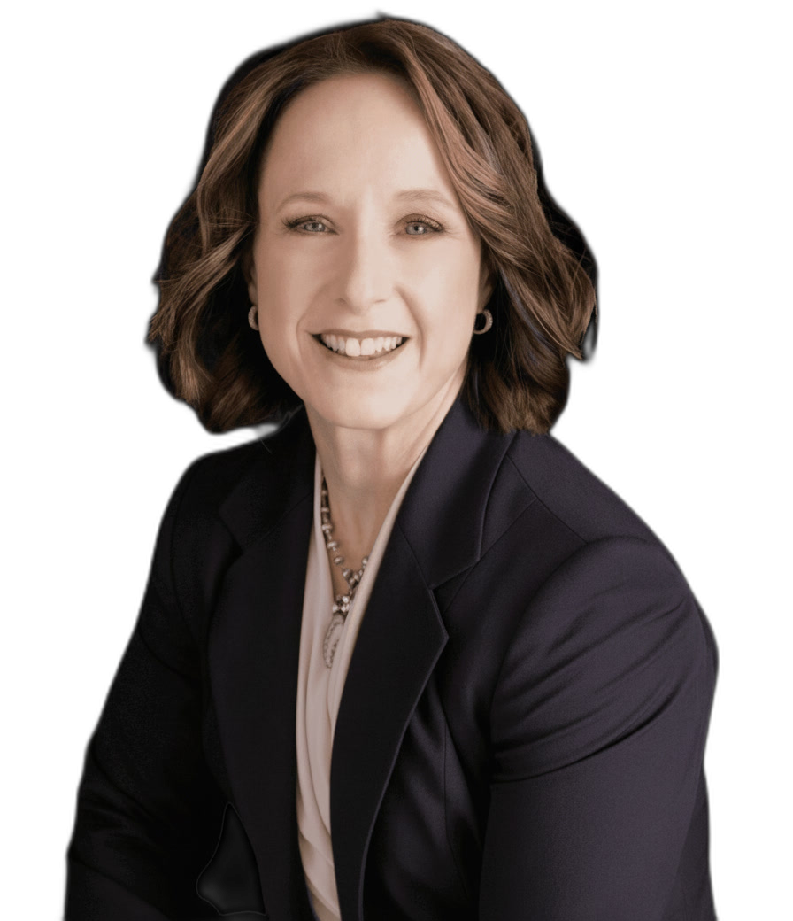A woman with shoulder-length brown hair, wearing a dark blazer, light blouse, and necklace, smiling at the camera against a plain light background.